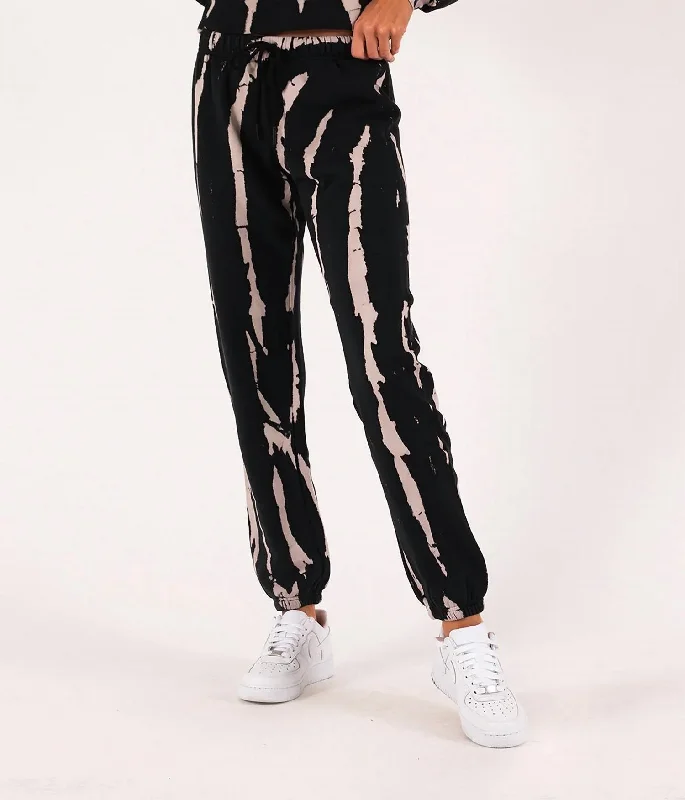 Printed tight trousers for men with camo, plaid, or abstract design for style -Bleach Tie Dye Gym Sweatpants In Black/cream