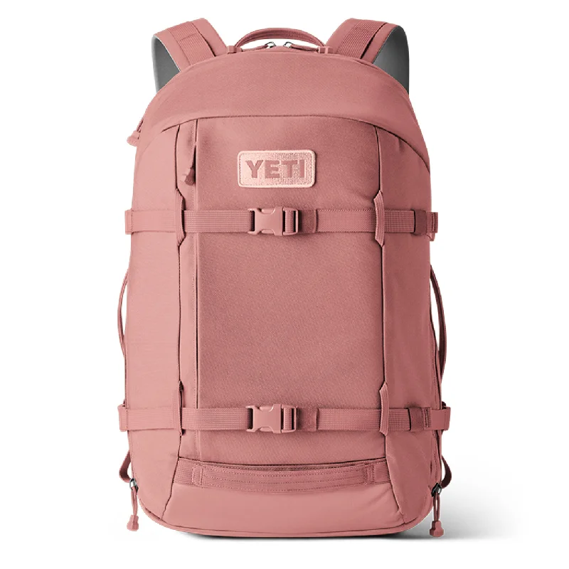 Vintage-inspired backpack with brass buckle details -YETI Crossroads 27L Backpack Sandstone Pink