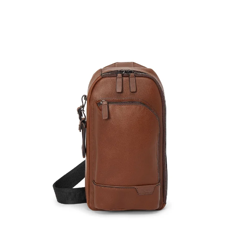 Expandable backpack for flexible storage capacity -TUMI Harrison Gregory Leather Sling